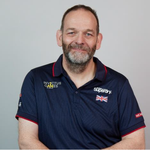 Personnel wears Invictus Games uniform in portrait.